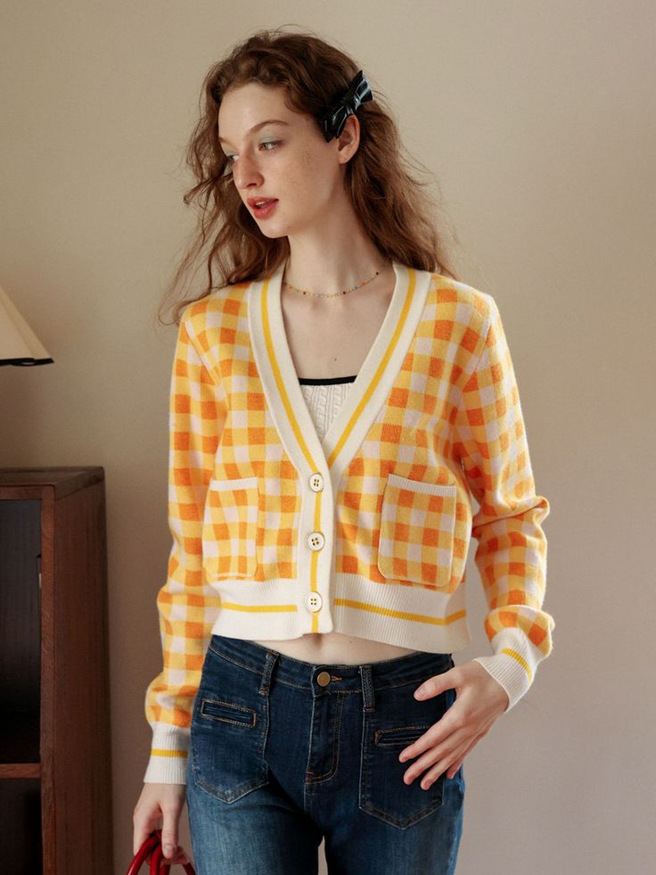 Editor’s notesThis is Cest Moidew’s yellow cardigan. This is a lively cardigan with a playful feel. The cardigan's color blocking and large chevron pattern add a unique touch to the item. While it has a basic design, the pattern and color combination bring brightness and a lovely vibe to your outfit. You can wear it comfortably on its own or layer it over an inner garment. Pairing it with a t-shirt and wearing the cardigan in an open style is also a great option.- A great item for daily wear- Ca Plaid Cotton Cardigan For Spring, Preppy Long Sleeve Cardigan For Spring, Preppy Long Sleeve Spring Cardigan, Yellow Casual Cardigan With Pockets, Yellow Spring Workwear Cardigan, Yellow Winter Cardigan With Pockets, Casual Yellow Cardigan With Pockets, Spring Preppy Workwear Sweater, Yellow V-neck Cardigan For Fall