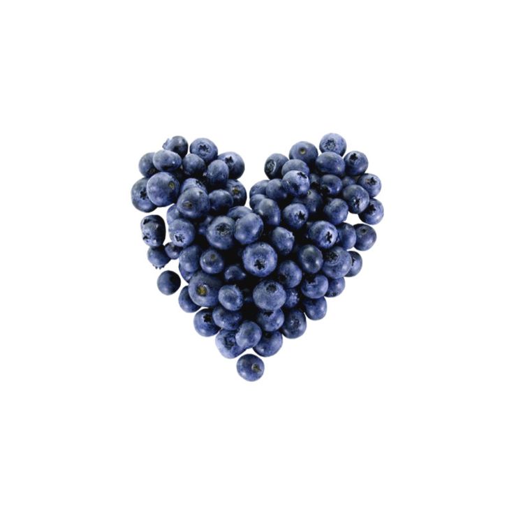 blueberries are arranged in the shape of a heart