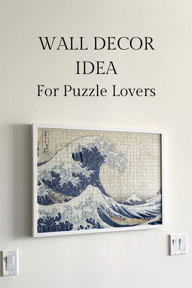 the wall decor idea for puzzle lovers is displayed in front of a white wall with black lettering