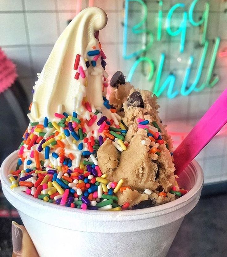 an ice cream sundae is topped with sprinkles