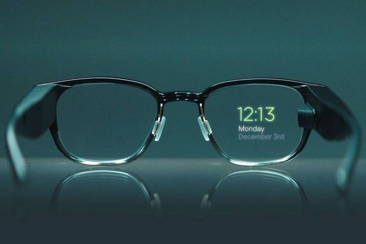 a pair of glasses sitting on top of a glass table with the date displayed in front of them