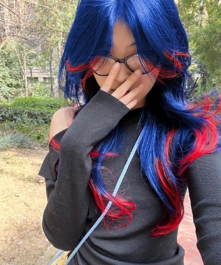 Colored Hair Outfits, Peekaboo Hair Styling Ideas, Stunk Strip Hairstyles Blue, Red And Blue Peekaboo Hair, Red And Blue Streaks In Hair, Blue Under Black Hair, Red Hair With Blue Underneath, Dark Red And Blue Hair, Blue Hair With Red Highlights