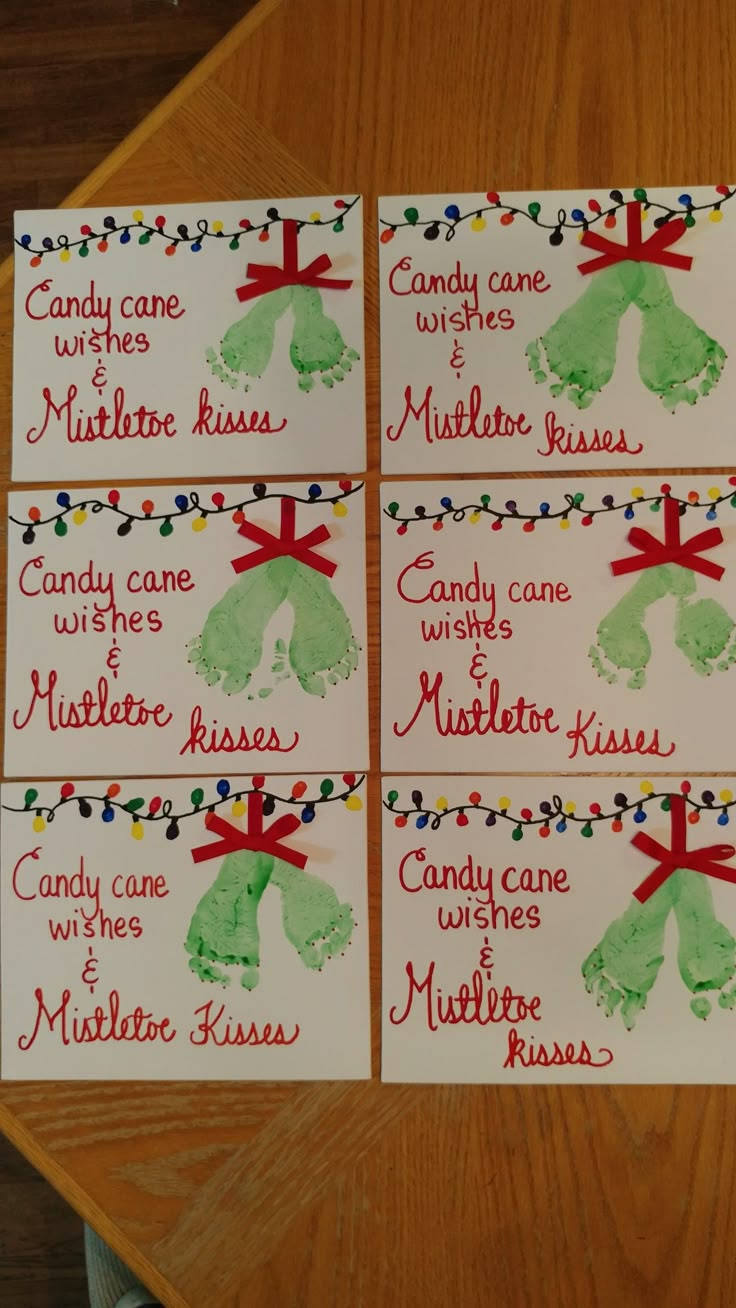 four cards with handprints on them that say candy cane kisses and mittens