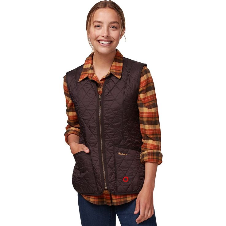 To elevate our cold-weather style while keeping comfy, we zip into this ultra-fashionable fleece-lined vest. The vest's feminine cut and relaxed fit let us cover up in cozy layers without looking or feeling bulky. Grosgrain binding and diamond-shaped stitching give this vest the premium appearance expected from Barbour's designs. Fall Fleece-lined Sleeveless Vest, Sleeveless Fleece-lined Vest For Fall, Fall Sleeveless Vest With Fleece Lining, Sleeveless Fall Outerwear For Outdoor, Outdoor Fall Vest With Fleece Lining, Fall Outdoor Vest Outerwear, Casual Sleeveless Vest With Fleece Lining, Casual Fall Vest With Fleece Lining, Brown Sleeveless Vest For Cold Weather