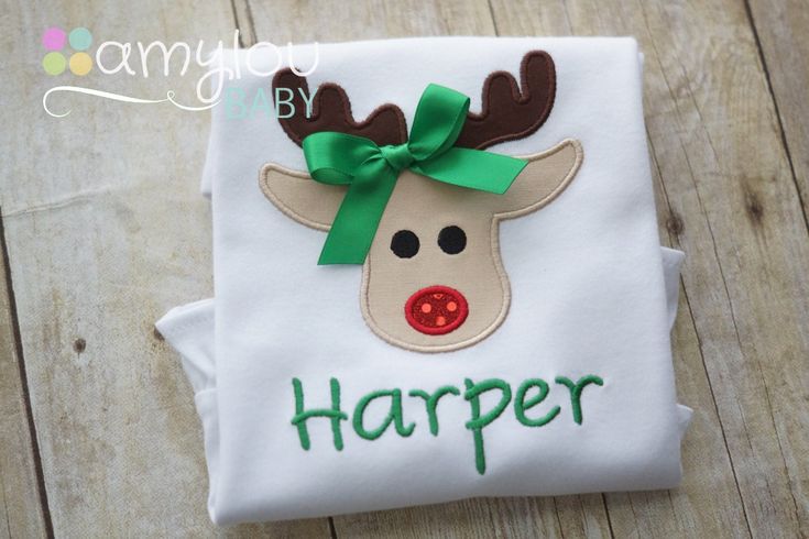 CURRENT PROCESSING TIME IS 2 WEEKS BEFORE ORDERS SHIP An adorable personalized Christmas tee shirt for your little sweetie! What a perfect way to achieve a high-end boutique look without sacrificing comfort - perfect for a long, exhausting Christmas day!! This embroidery design features a simple and cute reindeer head, with a sparkly nose, and satin bow to add a girly touch (which can be left off if desired). Design includes your child's name embroidered underneath the reindeer. See last picture Toddler Christmas Shirts, Hand Embroidery Letters, Toddler Christmas Shirt, Rudolph Reindeer, Christmas Toddler, Reindeer Head, Christmas Shirts For Kids, Christmas Tee Shirts, 25 Days Of Christmas