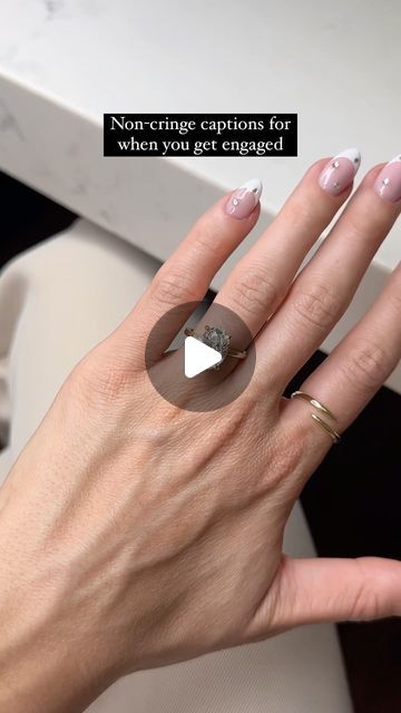 a woman's hand with a ring on it and the words non - cringe captions for when you get engaged