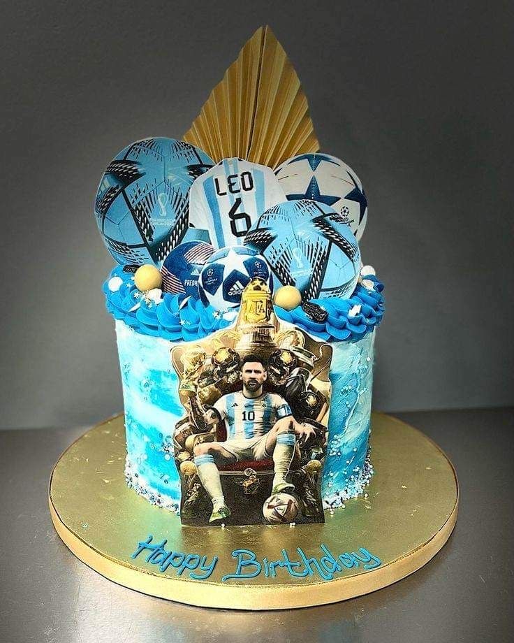 a birthday cake with an image of a soccer player on it