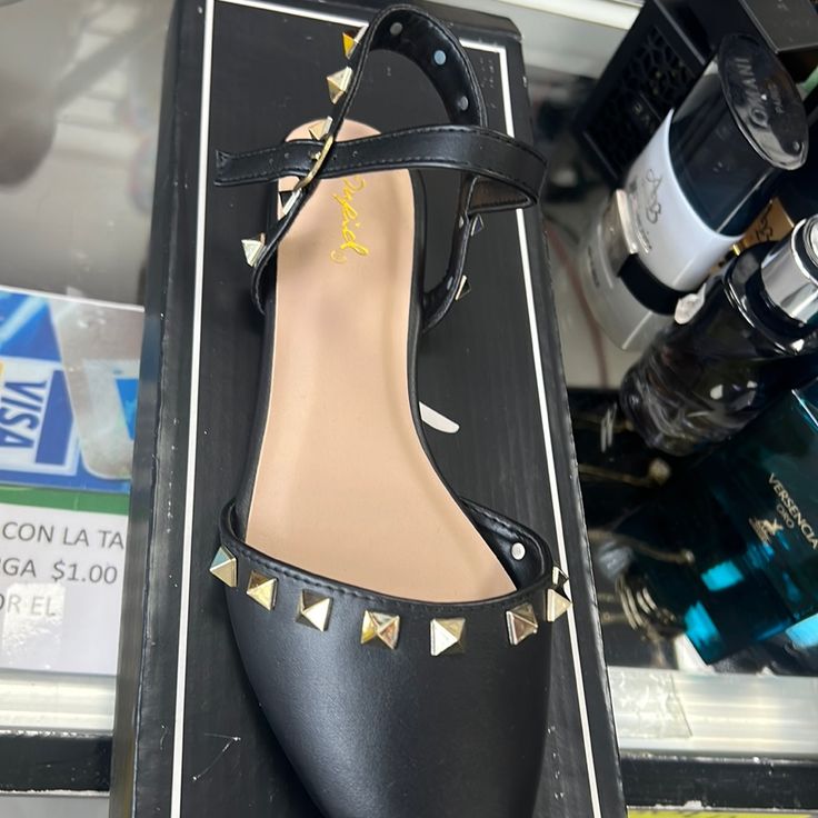 Size 7 6 Black Spiked Sandals For Spring, Edgy Spring Heels With Flat Heel, Edgy Spring Flat Heel Heels, Black Synthetic Flats For Party, Black Synthetic Party Flats, Black Flats For Spring Party, Black Party Flats With Ankle Strap, Black Low Heel Flats For Party, Black Spiked Heels For Spring