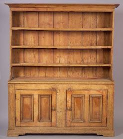 an old wooden bookcase with doors and drawers