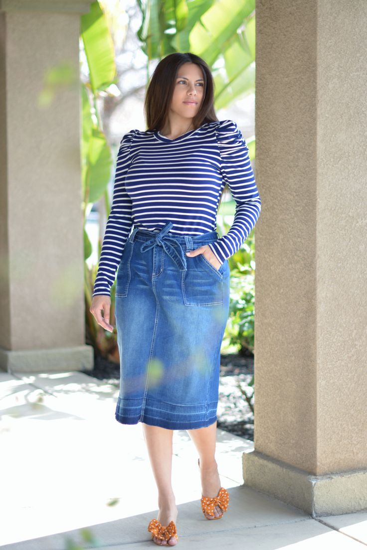 Light denim and spring/summer, YES! We all love a good denim skirt, so we are super excited to bring you this beauty! our Made from a stretchy denim, the Earlene skirt has a classic five pocket, a flattering tapered cut and unfinished hem. This one runs true to size but please check measurements. Modeled in XL, 5’6”. Paired with our Blanche navy striped top. 75% Cotton/23% Polyester/2% Spandex XSmall (waist 26”/hips 34”/length 26.5”)Small (waist 28”/hips 36”/length 26.5”) Medium (waist 30”/hips Fall Stretch Medium Wash Skirt, Chic Stretch Denim Skirt For Spring, Fall Denim Stretch Skirt, Fall Denim Skirt With Lined Detail, Casual Medium Wash Denim Midi Skirt, Stretch Cotton Dark Wash Denim Skirt, Stretch Dark Wash Denim Skirt, Spring Mid-rise Stretch Denim Skirt, Casual Dark Wash Midi Denim Skirt