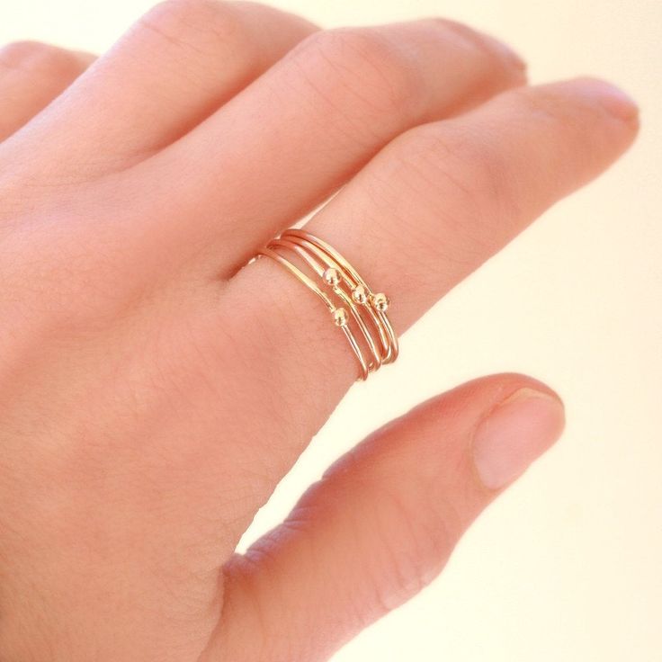 ONE dainty (1mm) solid 14k gold stacking band is adorned with a teensy 14k gold droplet. Small and dainty, stack several as a set or wear with some of the other stacking rings in our collection for variety. We think you could love these, too: ►Sterling SILVER tiny droplet ring: http://etsy.me/1x03Qe2 ►Gold GEMSTONE stacking ring: http://etsy.me/1zpjYI0 ►Gold INITIAL ring: http://etsy.me/1gamTHo ** Enjoy browsing our shop: http://etsy.me/1mC0gmu ** {YOU CAN SAVE!} Think bridesmaids, gifts, keep o Modern Gold Ring, Gold Initial Ring, Gemstone Stacking Ring, Gold Stacking Ring, Sparkly Ring, Stacking Bands, Midi Ring, Silver Stacking Rings, Knuckle Rings