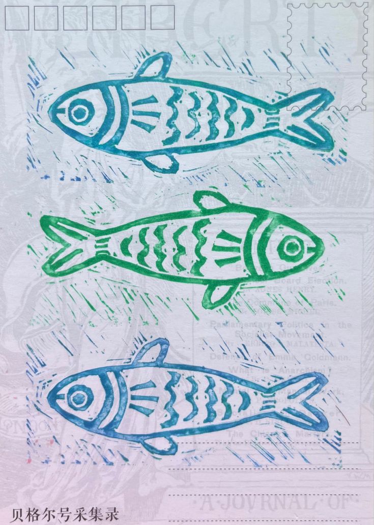 two fish are drawn on a sheet of paper with chinese writing in the middle and bottom