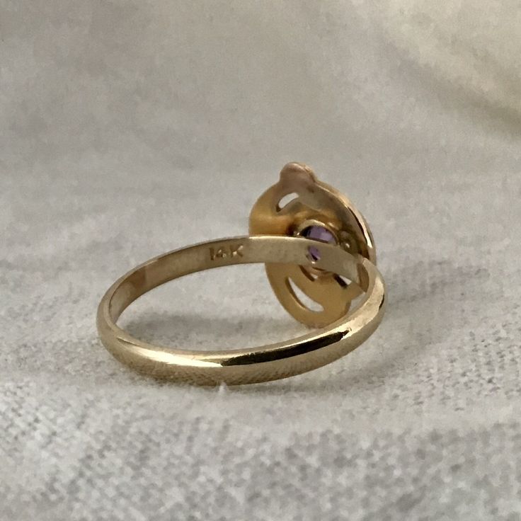 Art Deco ring / 14 karat amethyst ring / 14k solid gold vintage ring This gorgeous 14 karat yellow gold art nouveau ring features a 4 mm round amethyst in a yellow gold bezel setting. This art nouveau ring was redesigned from a stick pin and converted into a ring. The vintage pin was added to a half round 2.0 mm band perfect for stacking with other rings. Another fabulous way to wear these vintage rings are three or four across one hand. All stones and settings have been checked and tightened by Formal Yellow Gold Amethyst Ring With Bezel Setting, Art Nouveau Gold Ring With Gemstone, Art Nouveau Yellow Gold Ring, Yellow Gold Art Nouveau Jewelry For Anniversary, Art Nouveau Yellow Gold Jewelry For Anniversary, Gold Oval Amethyst Ring In Art Deco Style, Elegant Yellow Gold Amethyst Ring With Bezel Setting, Fine Jewelry 14k Gold Amethyst Ring With Round Cut, Classic Gold Amethyst Birthstone Ring