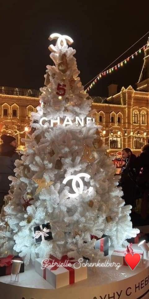 a chanel christmas tree is lit up at night