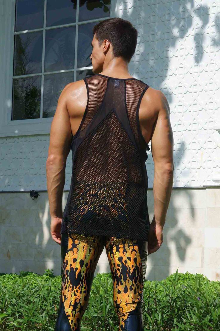 Perfect for those hot summer days and late-night dance parties, this mens mesh tank top features paneling in different mesh fabrics for a unique, eye-catching look. Crafted from high-quality, super breathable mesh materials, this see through fishnet top will keep you cool and comfortable all day (and night) long. The black color gives it a sleek and versatile appearance, while the mixed mesh paneling adds a touch of edginess and style. Whether you're looking to stand out in the crowd or just wan Summer Gym Racerback Vest, Summer Racerback Gym Vest, Breathable Sleeveless Tank Top For Summer, Breathable Summer Tank Top, Stretch Racerback Vest For Summer, Breathable Tank Vest For Summer, Breathable Tank Top Vest For Summer, Breathable Mesh Top For Spring, Sheer Sleeveless Mesh Top For Summer