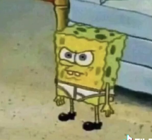 spongebob is standing in front of a bed