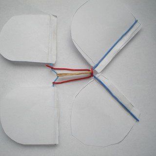 two pieces of paper with wires attached to them