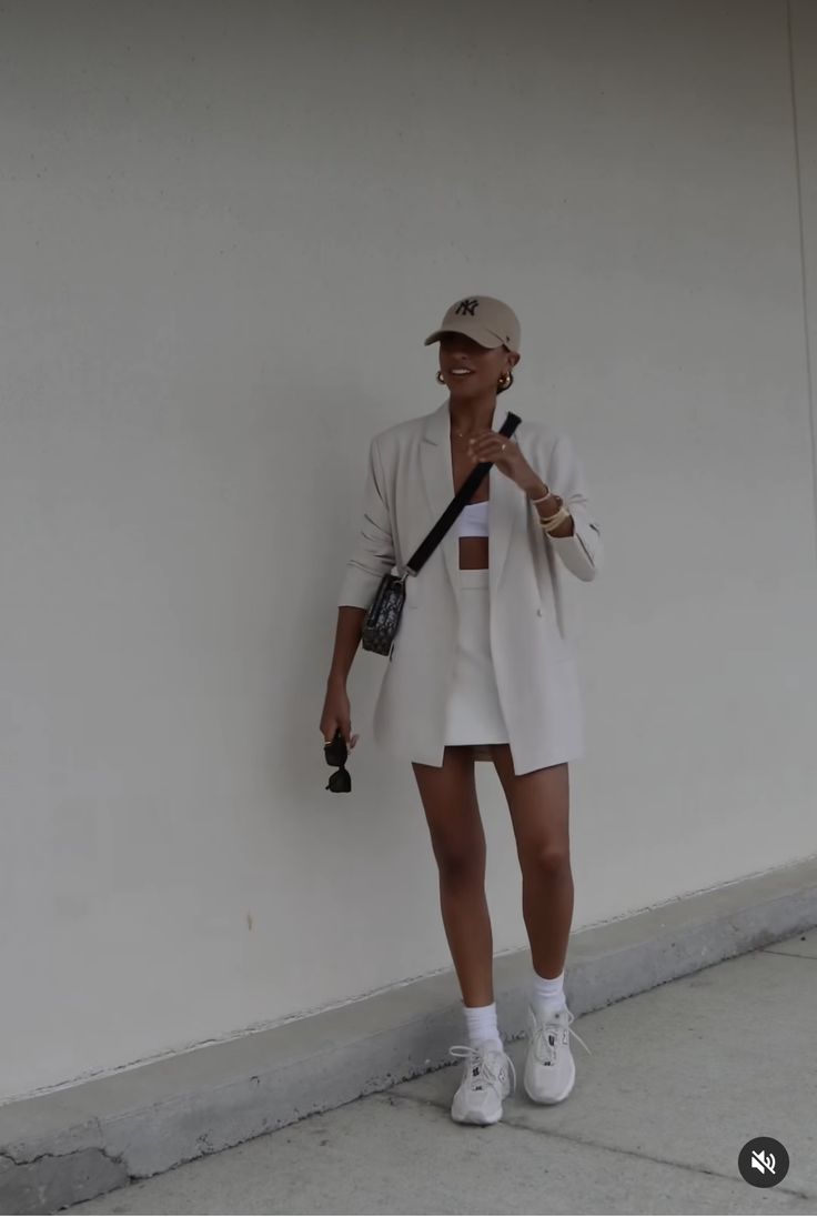 Summer Fall Transition Outfit Classy, Spring Sneaker Outfits Women, Sheek Summer Outfit, Hairdresser Clothes Outfits, Oversized Tan Vest Outfit, Shorts And Coat Outfit, Jean Shorts Street Style, Dress With Baseball Hat Outfit, Fall Summer Transition Outfits