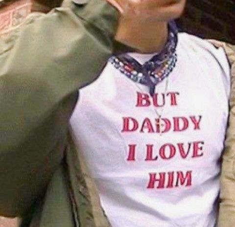 a man wearing a shirt that says but daddy i love him