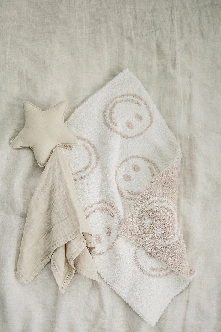 a white towel and a star on a bed