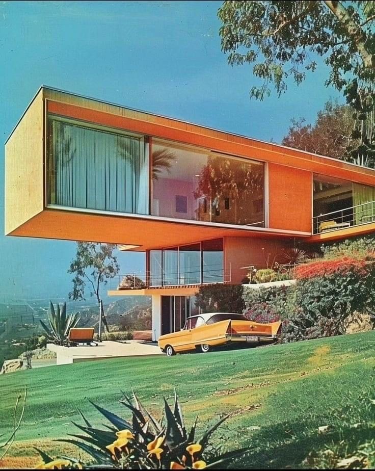 an orange house on the side of a hill