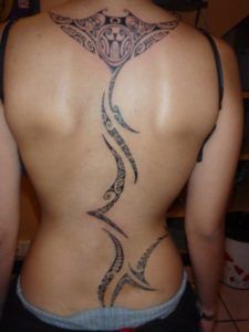 a woman with a tattoo on her back