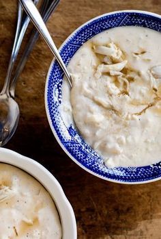 a bowl of oatmeal with spoons next to it