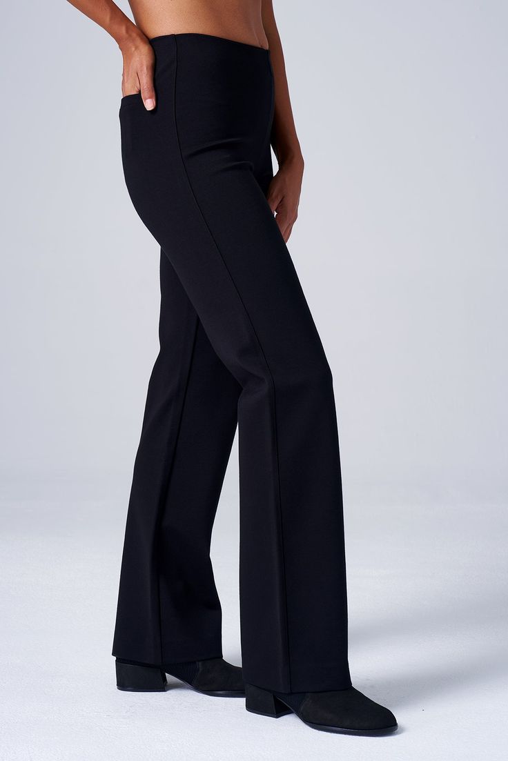 Tailored trousers with the comfort of leggings. An elongating, flattering silhouette in luxurious, wrinkle-resistant ponte is perfect for busy workdays and travel, while an invisible elastic waistband ensures a smooth, comfortable, bulk-free fit. THE DETAILS Four-way stretch luxe ponte provides structure and all-day comfort. Wrinkle-resistant for easy travel and all-day polish. Elongating bootcut silhouette pairs perfectly with boots or heels. Invisible, smoothing stretch grosgrain waistband off Elegant Office Pants With Pull-on Style, Pull-on 4-way Stretch Dress Pants For Work, Elegant Ankle-length Dress Pants With 4-way Stretch, Elegant 4-way Stretch Ankle-length Dress Pants, Elegant Ankle-length 4-way Stretch Dress Pants, Elegant Wide Leg Pull-on Pants For Work, Stretch Full-length Wide Leg Pants For Business Casual, Stretch Full Length Wide Leg Pants For Business Casual, Versatile Elastane Ankle-length Dress Pants