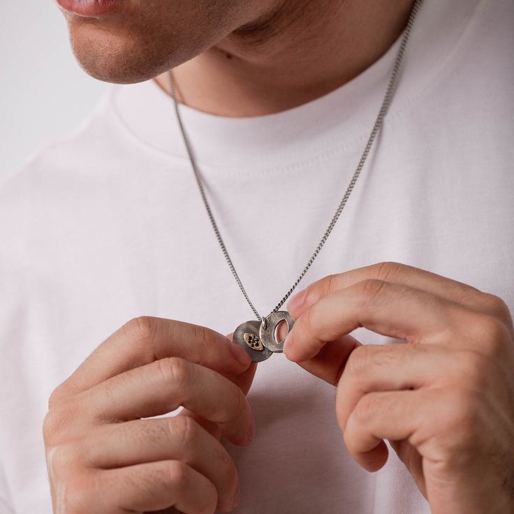 A brutalist sterling silver disc necklace with an evil eye for men and women in black oxidized silver. This unisex rustic protection pendant is 100% made by hand and it is an excellent choice for a birthday gift for him or a gift for women, too.  DETAILS * Metal: High Quality Sterling Silver 925 and 14K Gold * Finish: Black Oxidized * Dimensions: 23mm x 20mm  * Black Diamonds, 0.10ct * Length: 60 cm curb chain 100% nickel free. Delivered in an elegant gift package. SHIPPING All orders are shippe Gift Charm Necklace With Oxidized Round Pendant, Gift Charm Necklace With Oxidized Finish And Round Pendant, Gift Oxidized Finish Charm Necklace With Round Pendant, Minimalist Oxidized Jewelry For Anniversary, Oxidized Stainless Steel Medallion Jewelry, Gift Oxidized Finish Stainless Steel Necklace, Stainless Steel Round Pendant Necklace For Father's Day, Modern Coin Pendant Necklace As Gift, Sterling Silver Oxidized Dog Tag Jewelry