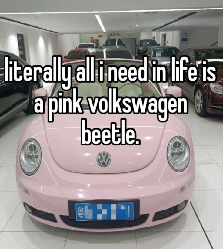 a pink vw bug parked in a garage with the words literally all i need in life is a pink volkswagen beetle beetle