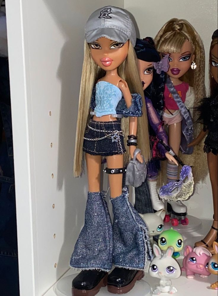 several dolls are lined up in a closet with one doll holding a purse and the other is wearing jeans