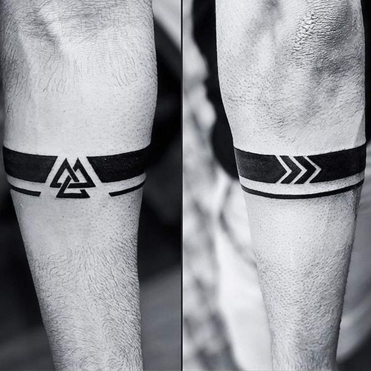 a man's leg with a black and white tattoo on it