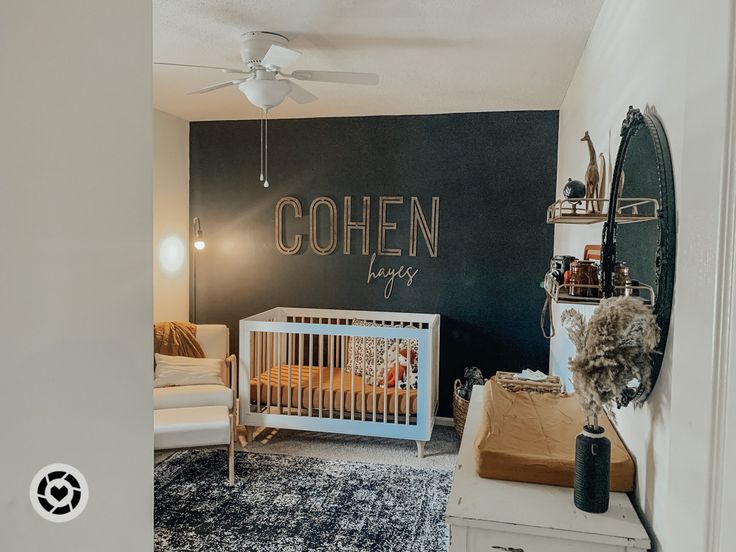 a baby's room is decorated in black and white