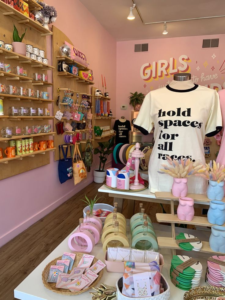 there is a t - shirt and other items on display in the store's window