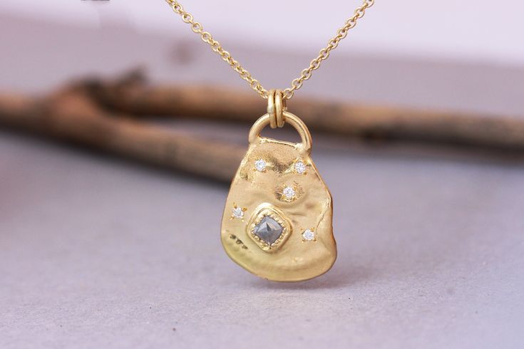 "Amazing gold pendant necklace set with grey and white diamonds in a Boho antique style design, available in 14k, 18k, or 22k solid yellow, white, or rose gold. This gold boho necklace is stunning and unique. It has a raw asymmetric-shaped pendant in an antique design. The pendant is adorned with a big grey raw square diamond set and surrounded by tiny gold dots and 5 white diamonds set using a star-like design. The pendant has a rustic dots embossed texture and is connected to a necklace by 2 g Fine Jewelry Engraved Diamond Pendant Necklace, Engraved Diamond Pendant Necklace In Fine Jewelry Style, Gold Diamond Pendant Necklace With Gemstone, Gold Diamond Necklace With Gemstone Pendant, Engraved Diamond Pendant Necklace, Heirloom Pendant Necklace With Rose Cut Diamonds, 14k Gold Pendant Diamond Necklace With Rose Cut, 14k Gold Pendant Diamond Necklace With Rose Cut Diamonds, 14k Gold Pendant With Rose Cut Diamonds