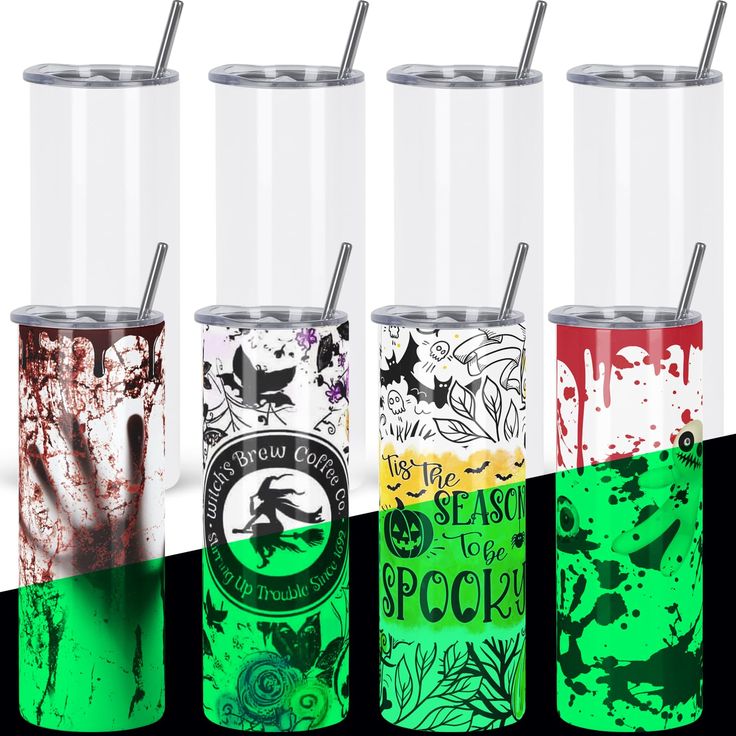 four different colored tumblers with lids and straws on them, all decorated in various designs