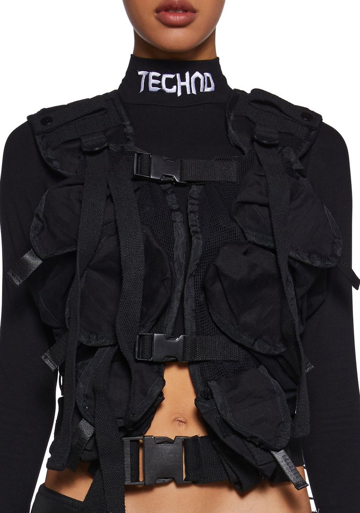 cuz you're ready for anything. This cargo vest has a canvas twill construction, mesh paneling, adjustable front and shoulder straps, lace-up detailing, six utility pockets, and front buckle closures. Cargo Vest, Utility Vest, Utility Pockets, Rave Festival, Cargo Pocket, Dolls Kill, Exclusive Collection, Festival Fashion, Online Boutique