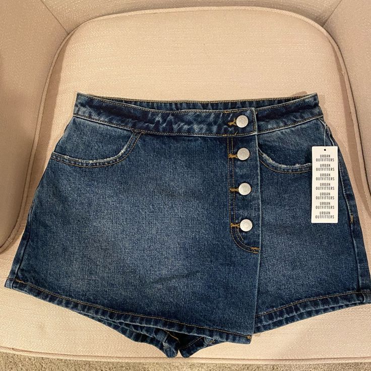 Urban Outfitters Denim Skort. New With Tags. Size 27. Adorable! Urban Outfitters Casual Denim Skirt For Spring, Urban Outfitters High Waist Jean Shorts For Spring, Urban Outfitters High Rise Bottoms For Spring, Urban Outfitters High-rise Bottoms For Spring, Urban Outfitters Fitted Mid-rise Jeans, Urban Outfitters Denim Blue Denim Bottoms, Mid-rise Denim Bottoms By Urban Outfitters, Urban Outfitters High Rise Denim Blue Bottoms, Urban Outfitters Denim Blue Bottoms