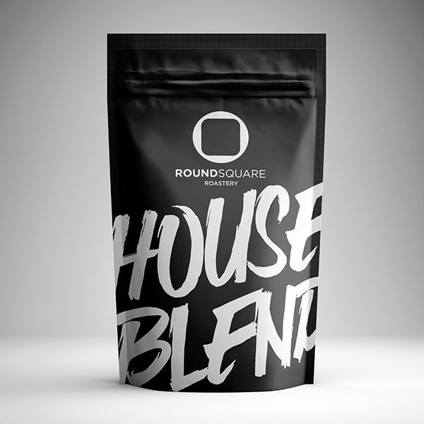 a bag of house blend sitting on top of a table