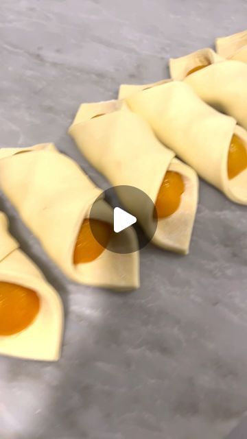 some dumplings are being rolled up on a table