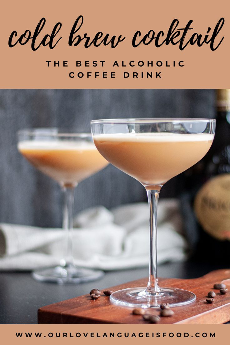 two glasses filled with coffee drink sitting on top of a wooden cutting board