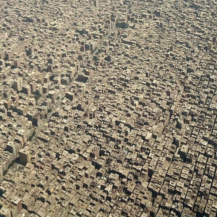 an aerial view of a city with lots of tall buildings