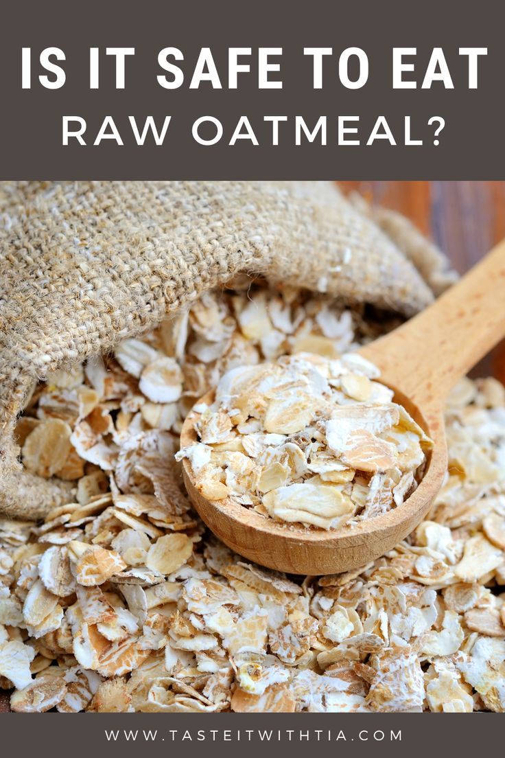 a wooden spoon with oatmeal in it and the words is it safe to eat raw oatmeal?