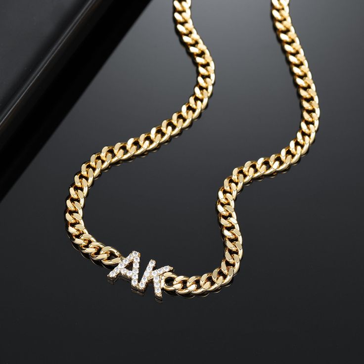 Personalize this cuban chain with your initials or surprise them with a meaningful gift. Initial Pendant Necklace With Curb Chain, Anniversary Cuban Link Necklace With Adjustable Chain, Personalized Gold Cuban Link Name Necklace, Gift Necklace With Initial Pendant And Curb Chain, Gold Cuban Link Name Necklace, Personalized Cuban Link Gold Name Necklace, Elegant Personalized Chain Link Necklaces, Gold Plated Cuban Link Necklace Gift, Gold Plated Cuban Link Necklace As Gift