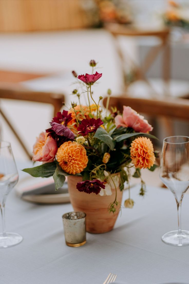 Summer Floral Wedding Centrepiece with pops of orange and pinks in terracotta pots Glasshouse Wedding, Summer Floral Wedding, Glass House Wedding, Orange And Pink Wedding, Summer Flower Arrangements, Wedding Centrepiece, Bright Wedding Flowers, Event Centerpiece, Wedding Floral Centerpieces