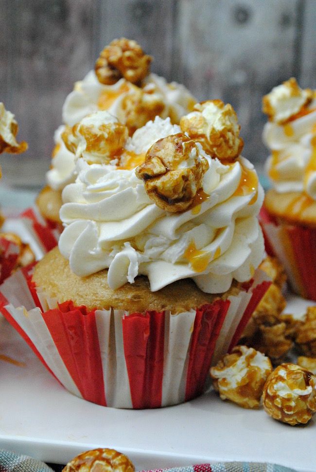 cupcakes with white frosting and caramel sprinkles