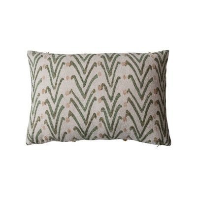 a green and white pillow on a white background