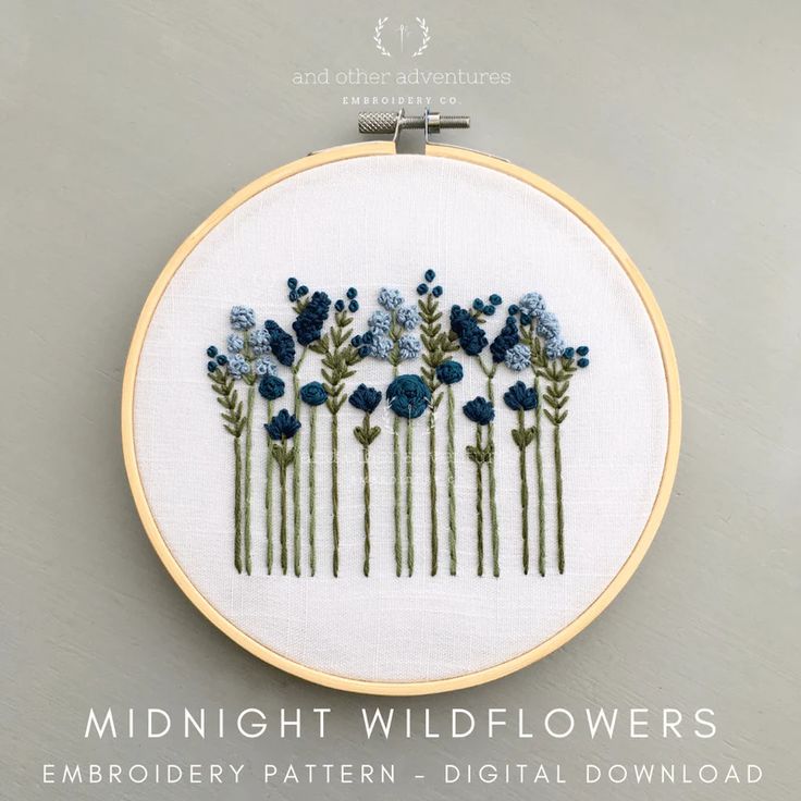 a cross stitch pattern with blue flowers in the middle and text that reads midnight wildflowers embroidery pattern - digital download