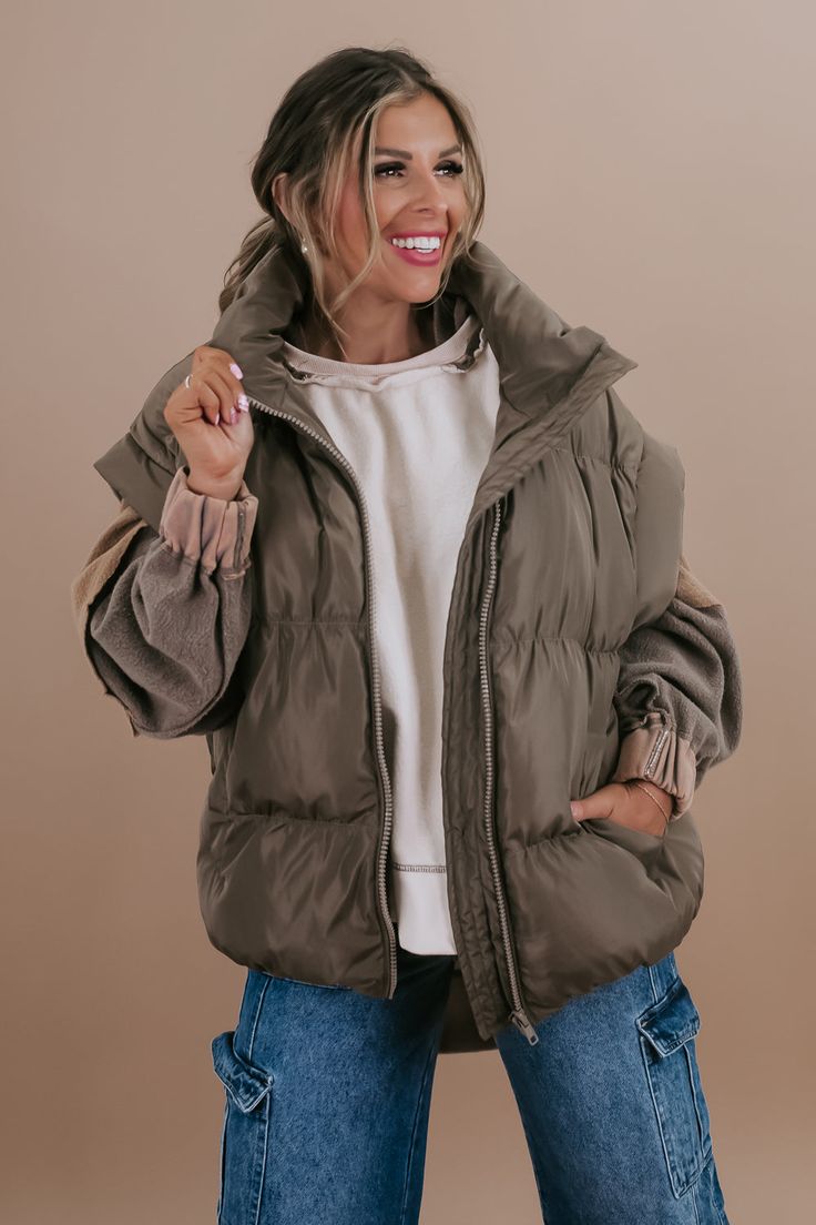 Stay on-trend and cozy with our Oversized Puffer Vest. This versatile piece combines comfort and style, featuring a generously sized silhouette that adds a contemporary edge to your winter wardrobe. Perfect for layering over your favorite holiday outfits, this puffer vest brings both warmth and fashion-forward flair to your seasonal ensembles. Puffer vest Functional zipper closure Functional pockets Cut off sleeve 100% polyester Imported Model Specs: Karli is wearing a size small in the photo. S Trendy Nylon Vest For Fall, Trendy Oversized Vest, Trendy Winter Cotton Puffer Jacket, Trendy Fall Puffer Jacket For Cold Weather, Trendy Cotton Puffer Jacket For Winter, Trendy Solid Vest For Cold Weather, Trendy Solid Color Cold Weather Vest, Winter Cotton Vest For Cold Weather, Casual Fall Vest With Fleece Lining