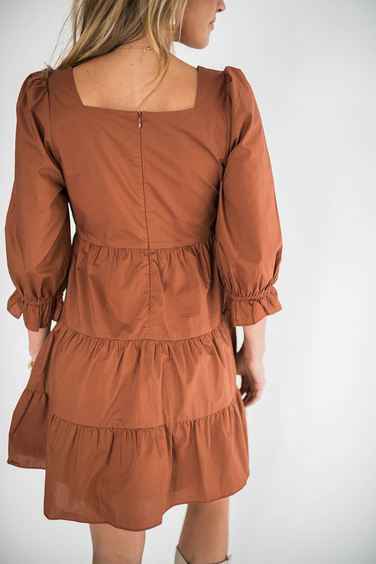 Have you ever seen a more perfect outdoor concert, drinks with friends, brunch, work, happy hour dress? Our Willow dress is the dress for every occasion. We love it paired with western boots for the perfect casual chic vibe. Grab her before she is gone. Features: Square neckline Zip Closure 3/4 sleeve with detail Square back Small : bust 30” length 32” Medium : bust 32” length 33” Large : bust 34" length 33.5" Model is wearing a medium. Height 5'8", Bust 35", Waist 28.5", Hip 34.5" Fabric conten Square Neck Mini Dress For Spring Workwear, Spring Workwear Mini Dress With Square Neck, Fall Ruffle Dress With 3/4 Sleeves, Fall Dresses With Ruffles And 3/4 Sleeves, Fall Midi Dress With Ruffle Hem For Brunch, Square Neck Dresses For Dress Down Days In Fall, Square Neck Spring Workwear Dresses, Fall Midi Dress For Brunch, Knee-length, Fall Square Neck Dress For Date Night